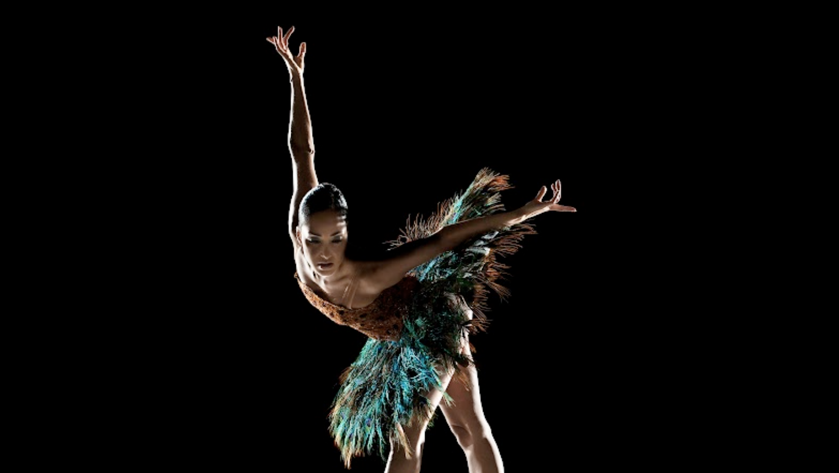 ancer Caroline Rocher en pointe wearing a peacock-like tutu